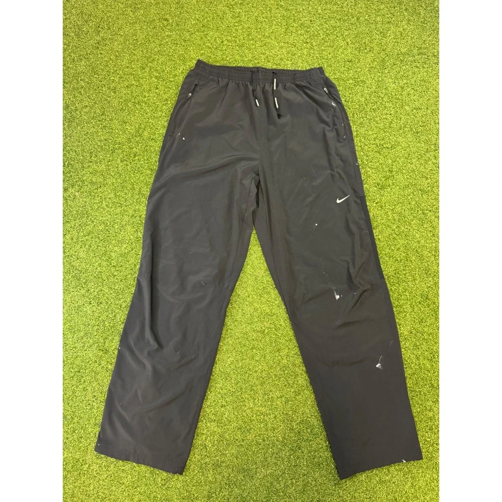Nike Dri-FIT Mens Black Track Pants Large Ankle Zip Athletic Paint Splatter - Picture 1 of 9